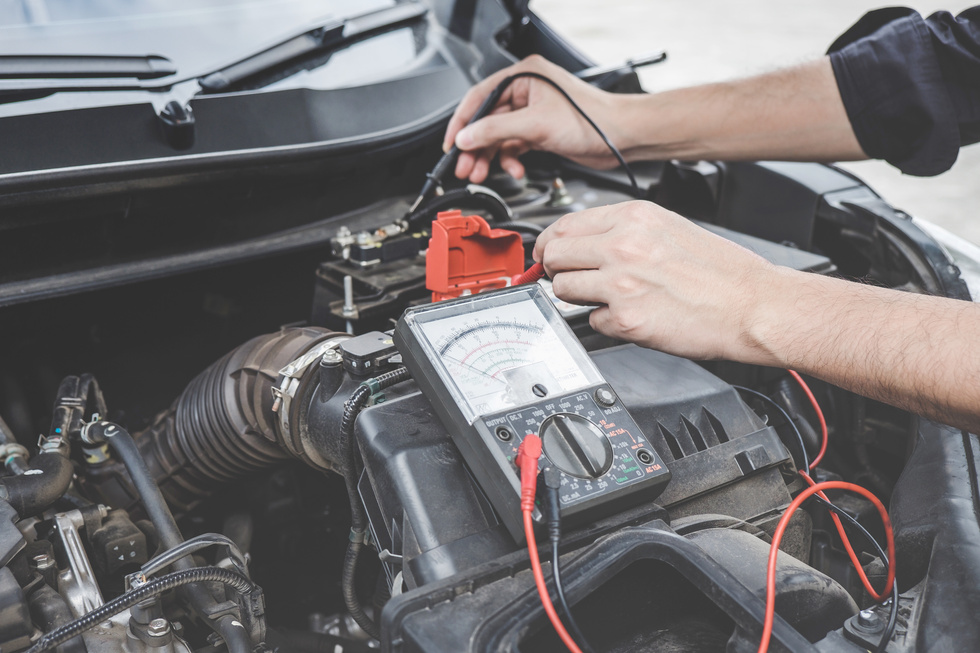 Mechanic Repairing Car Engine